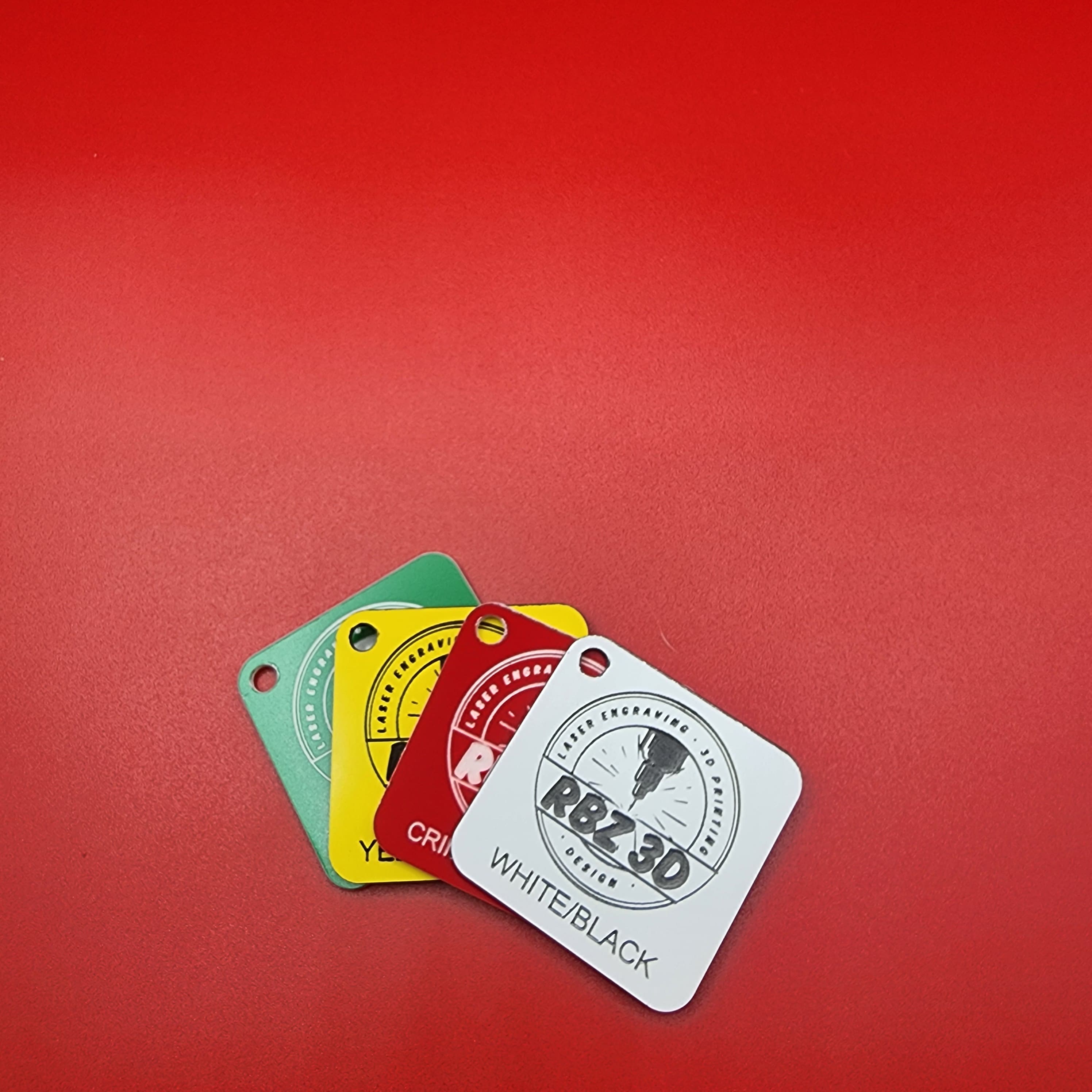 Traffolyte colour samples - white, crimson, yellow, green engraving laminate